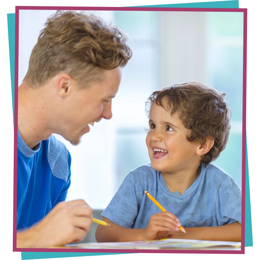 A boy looking at a map through a magnifying glass